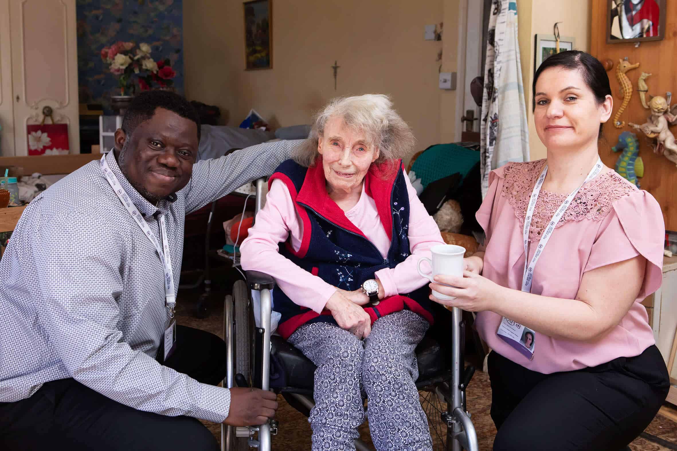 Image of carers with a happy resident