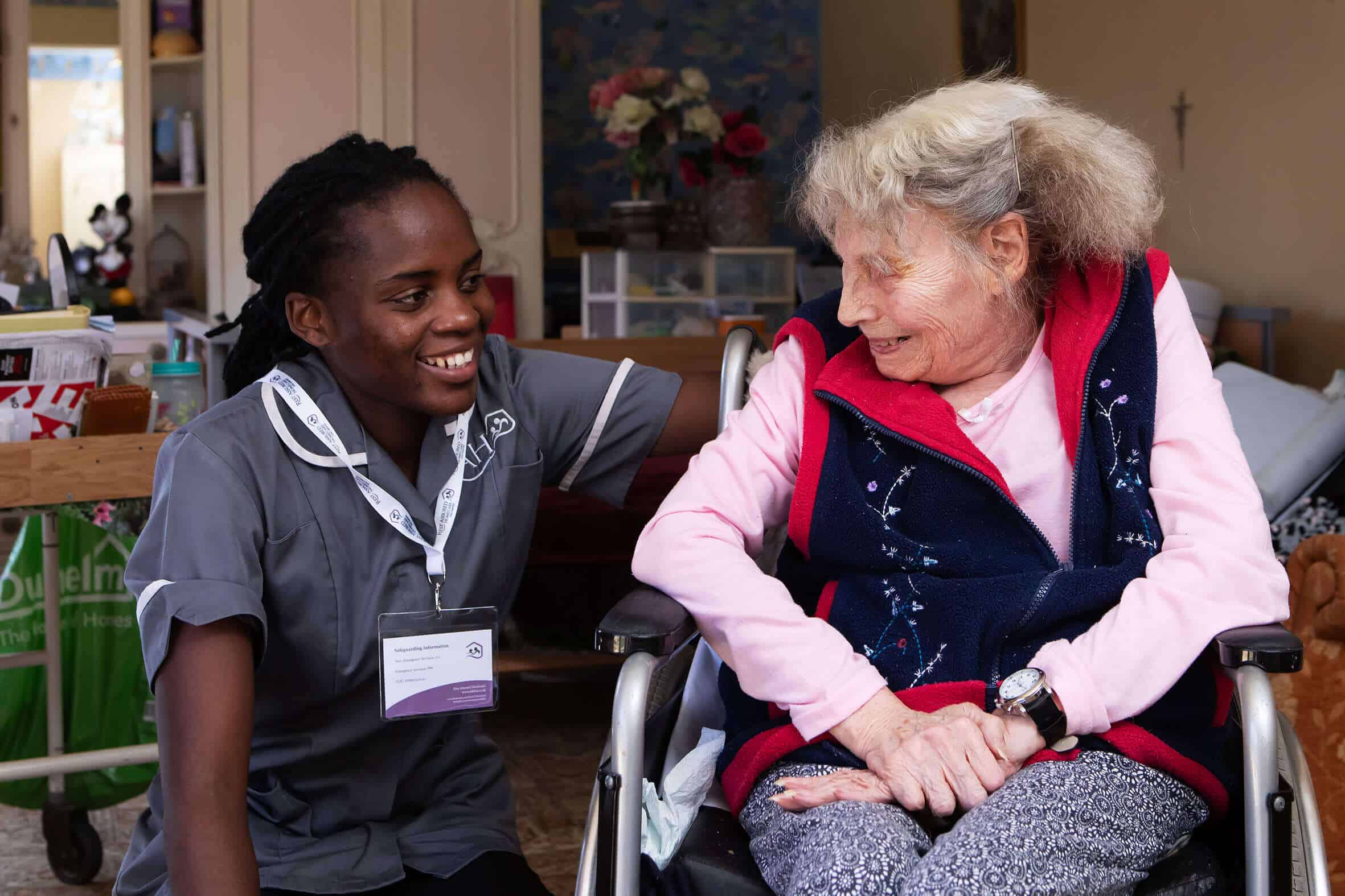 Image of carers with a happy resident
