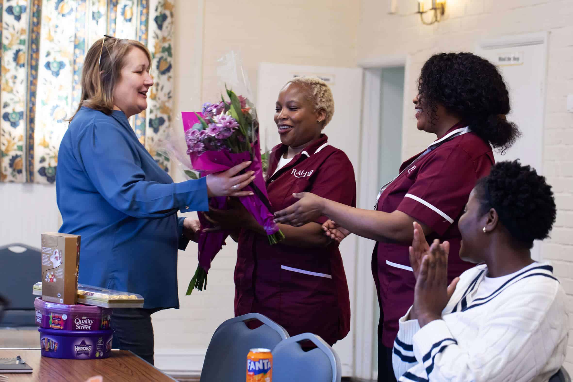 Image of happy careers receiving gifts