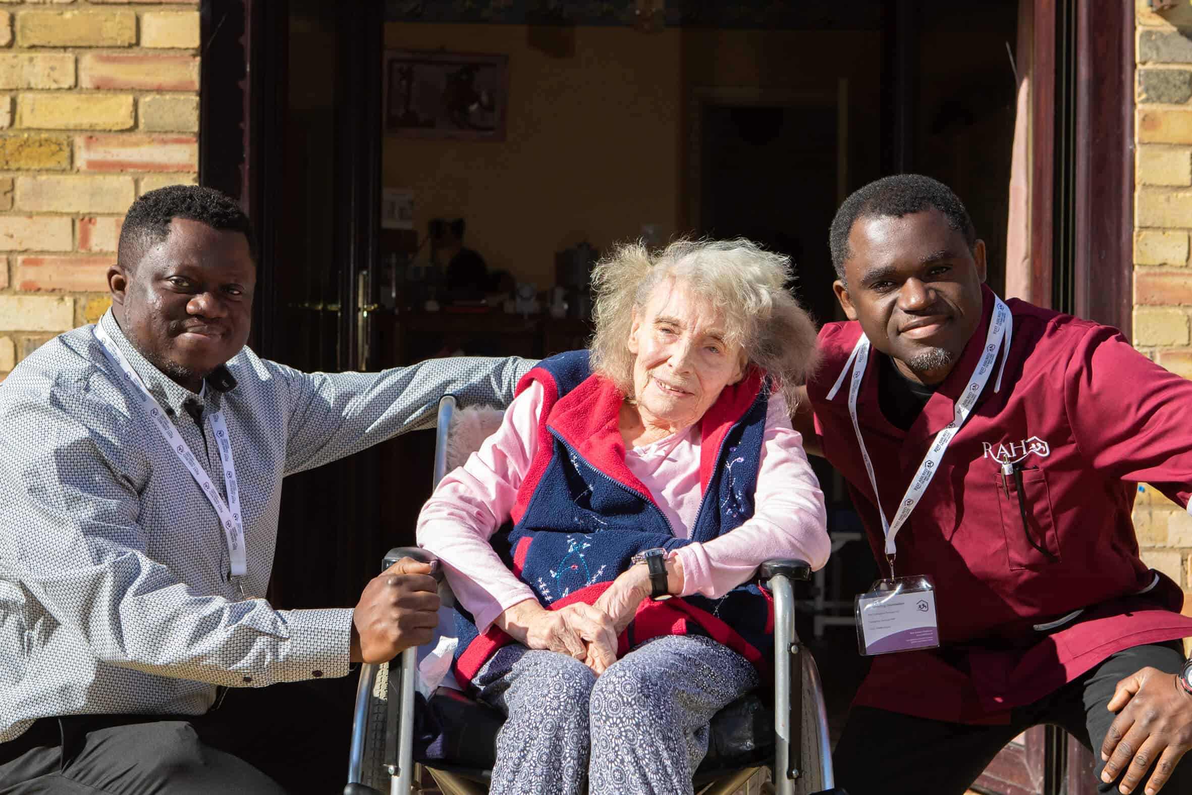 Image of carers with a happy resident